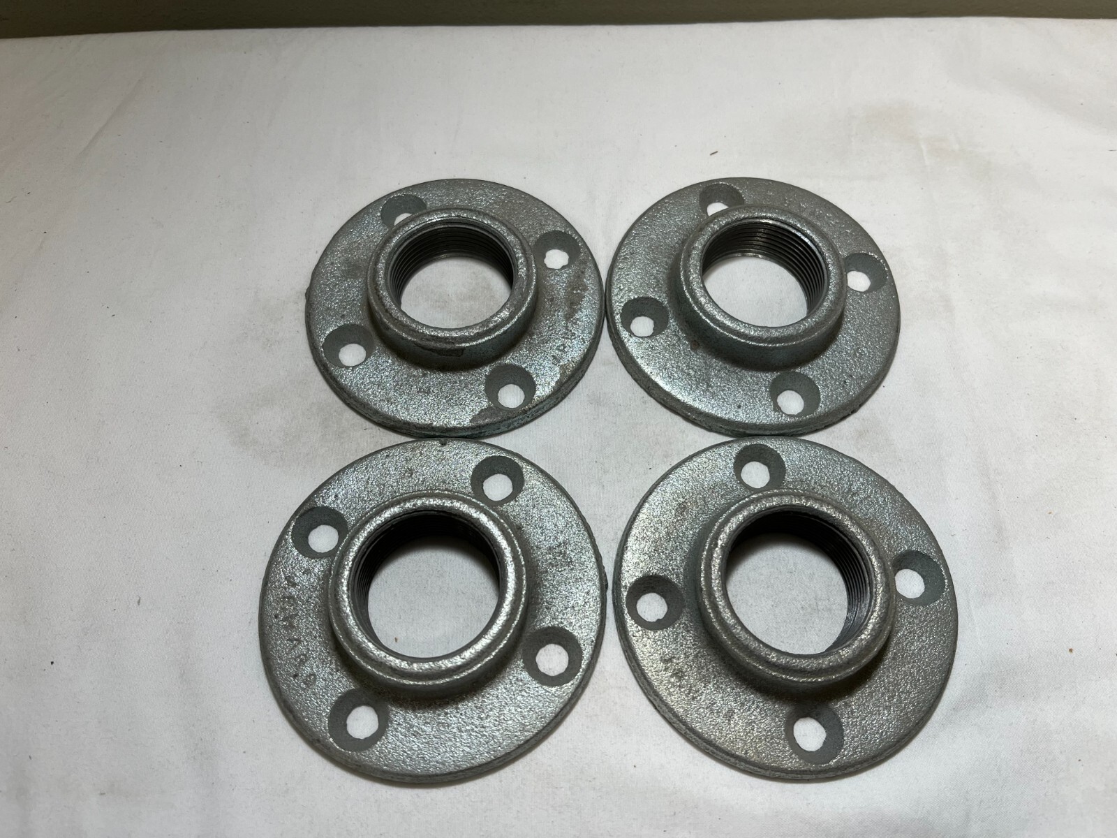 Lot of (4) 1-1/4″ Galvanized Floor Flange Plate