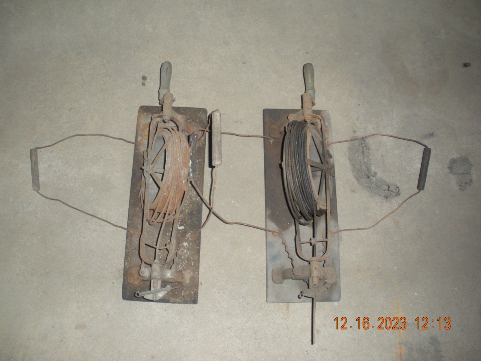 Two *MADE IN USA* antique hand cranked drain snakes, used