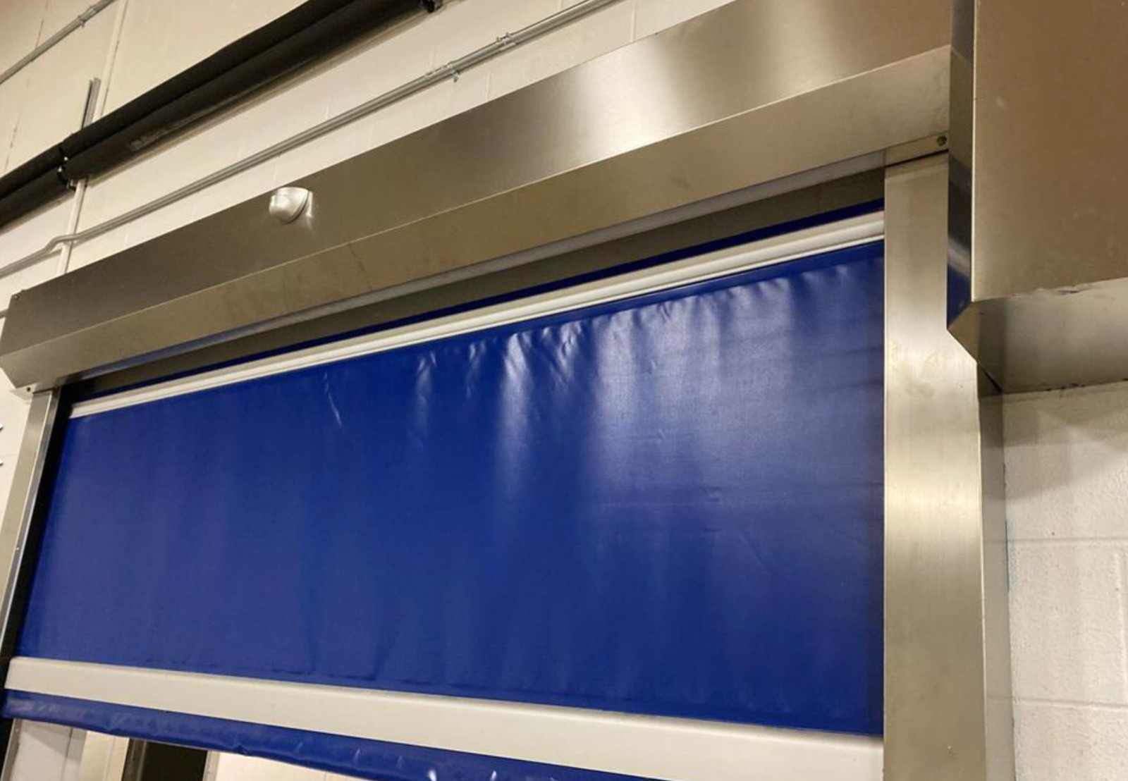 Electric, 8×8 ft opening, stainless component, motion sensor commercial door